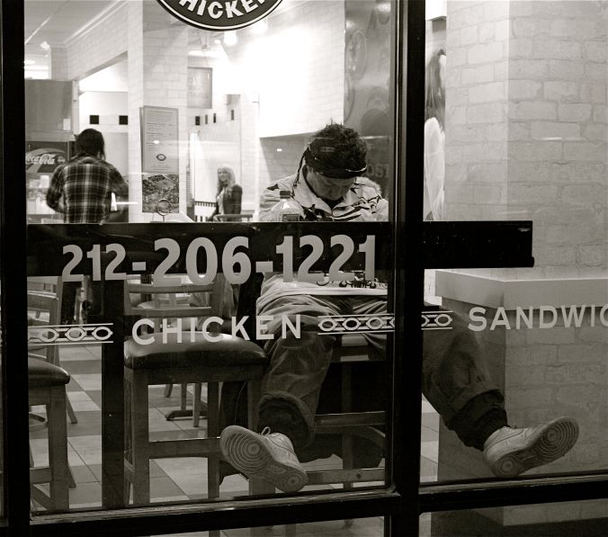 new york city chicken place man sleeping