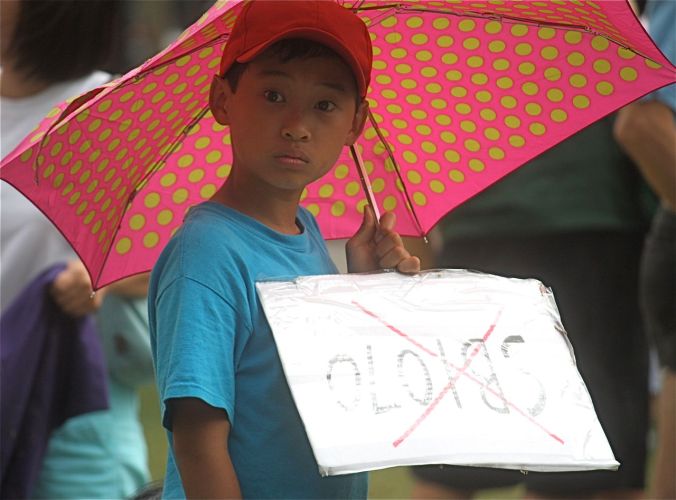 boston copley square immigration protest july 10 2010 young protester umbrella