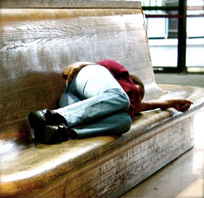boston south station woman sleeping on bench