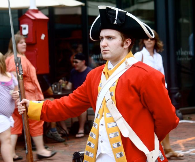 boston faneuil hall man dressed in red outfit soldier