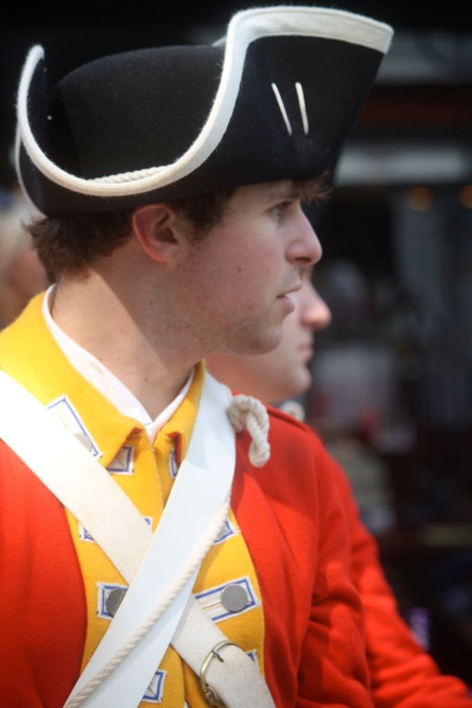 boston faneuil hall man in red uniform profile