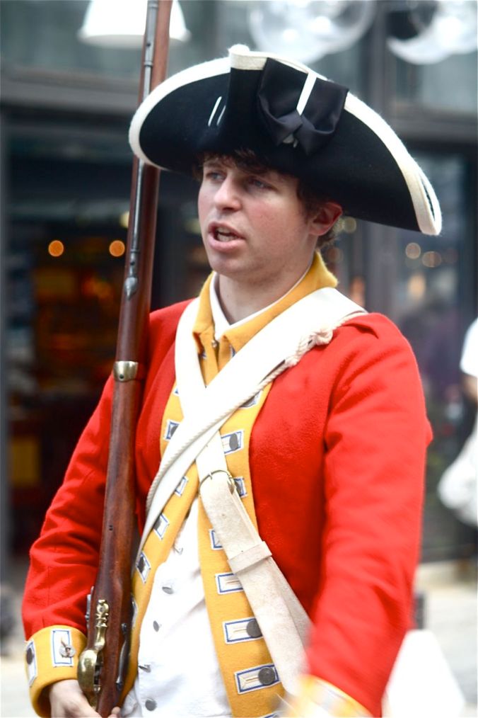 boston faneuil hall man in red uniform