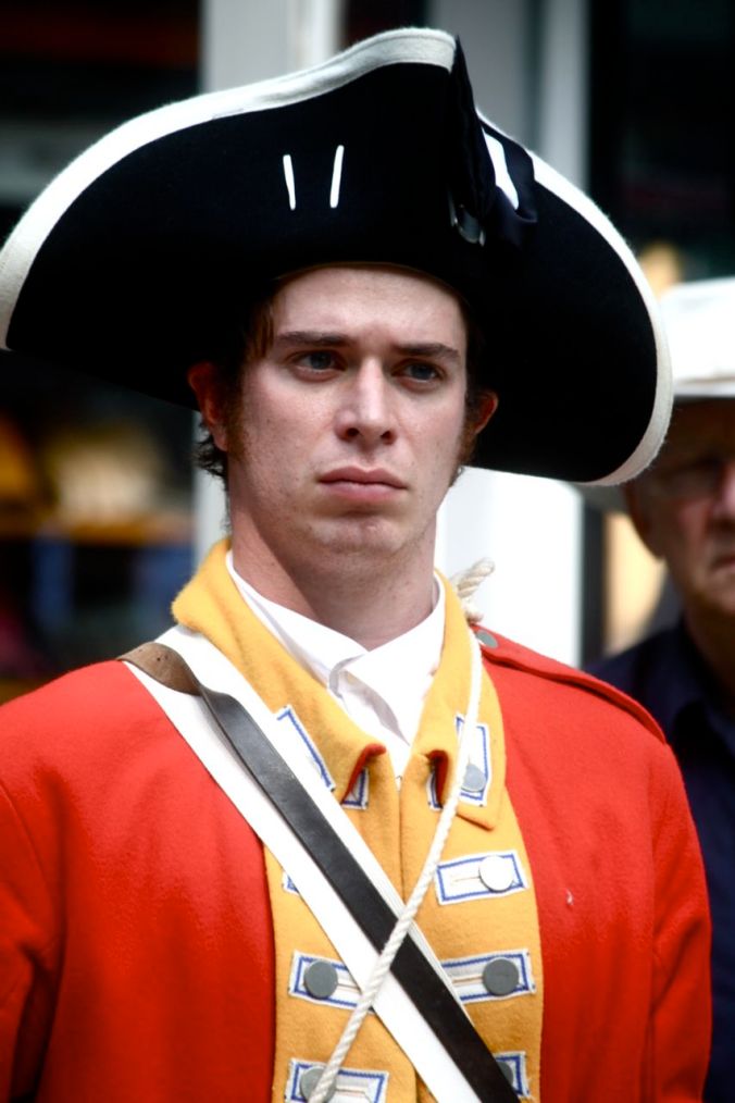 boston faneuil hall man in red uniform