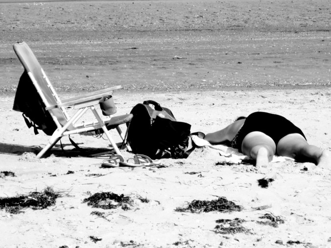 boston carson beach person laying in the sand