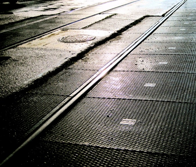 boston commonwealth avenue t tracks rain sunlight