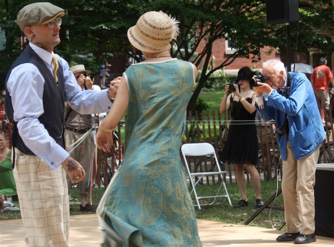 new york governors island jazz age party bill cunningham taking a photo of a couple dancing
