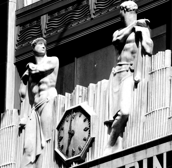 new york city midtown art deco building figures