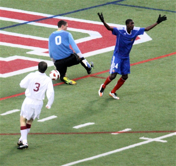boston harvard university stadium haiti leve haitan player with arms up