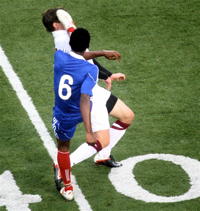 boston harvard university stadium haiti leve player kicking other player in face