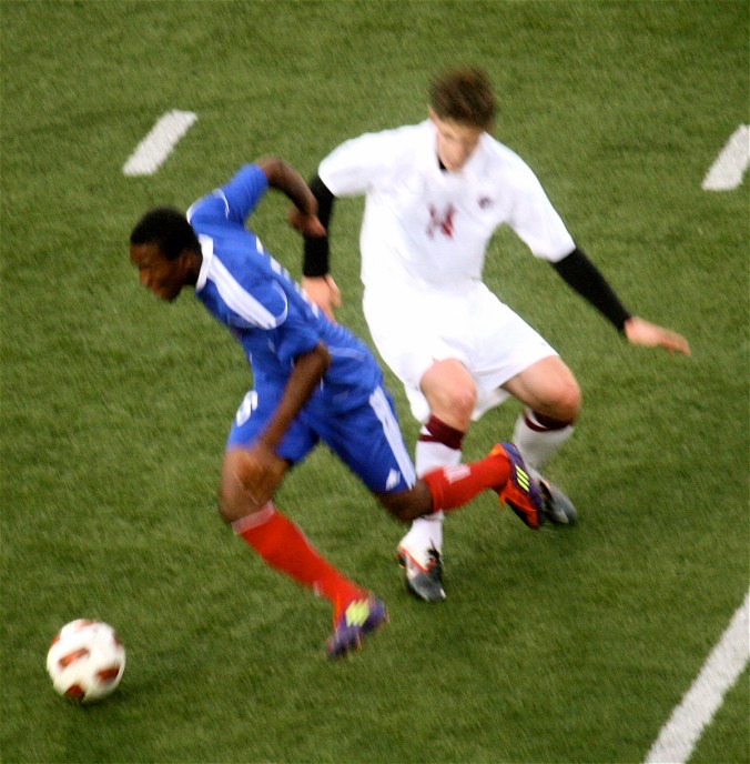 boston harvard university stadium haiti leve two players one player jumping