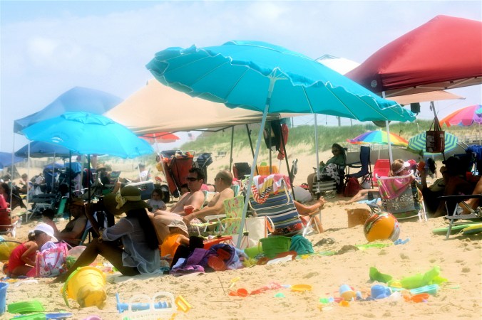 virginia beach sand bridge memorial day beach view blue umbrella