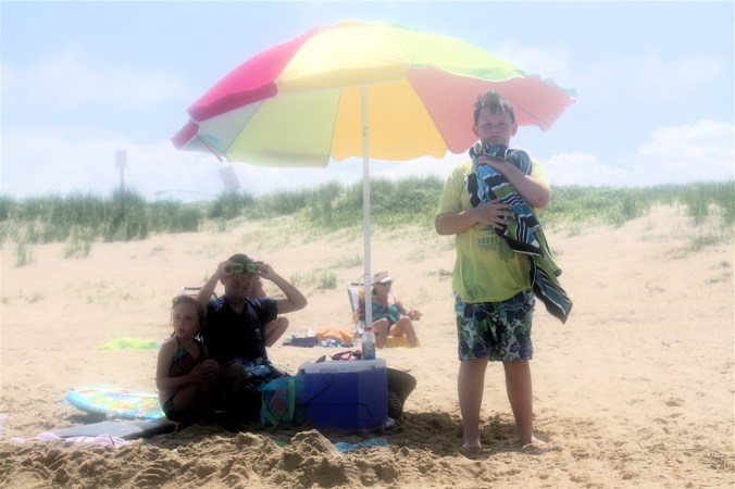 virginia beach sand bridge memorial day beach view boy holding towel