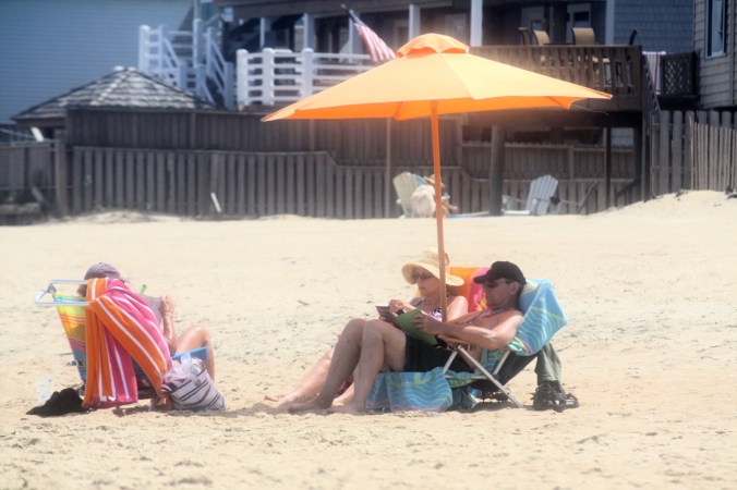virginia beach sand bridge memorial day beach view orange umbrella