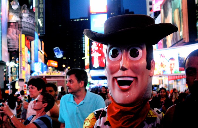 new york city times square man in costume woody from toy story