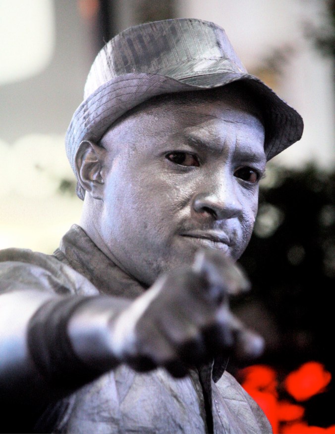new york city times square silver man pointing