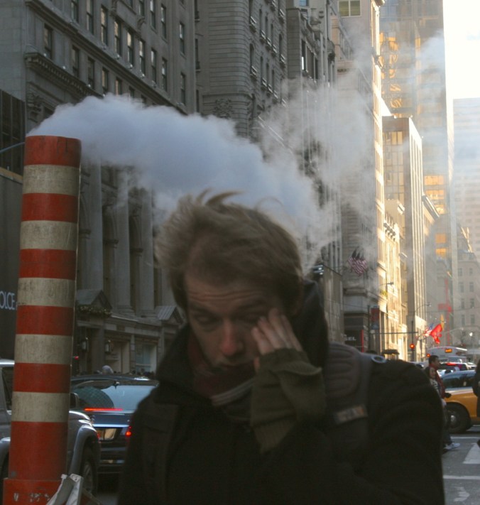new york city fifth avenue man in front of steam