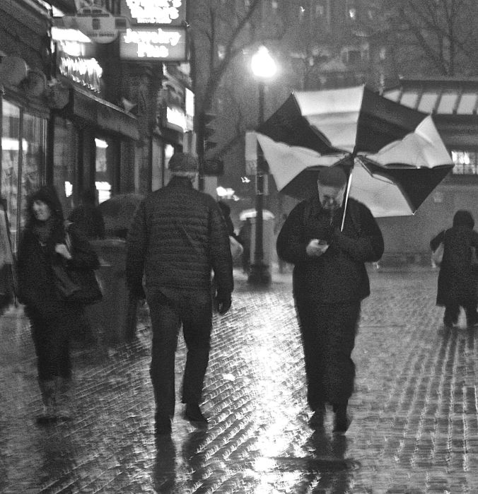 boston downtown crossing man with umbrella flapping up