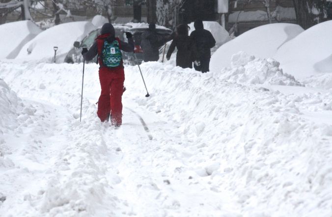 boston snow storm february 9 blizzard nemo person on skis on green line 3