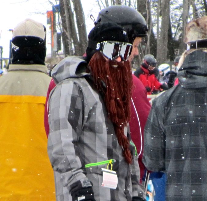 wachusett ski lift line man with fake beard face warmer