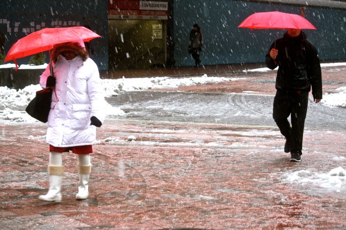 boston downtown crossing snow red umbrellas