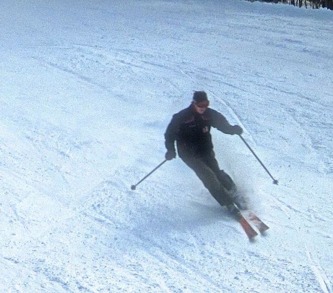 sunapee skier going down mountain