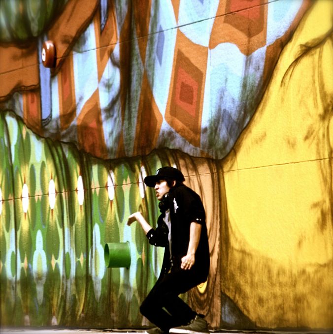 boston greenway os gemeos mural man performing 1