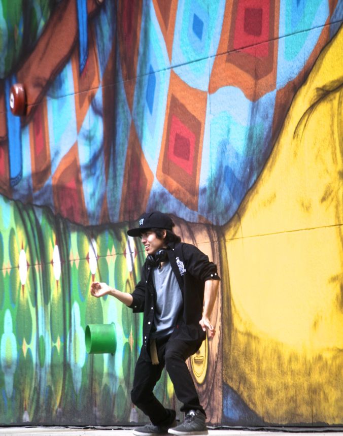 boston greenway os gemeos mural man performing 2