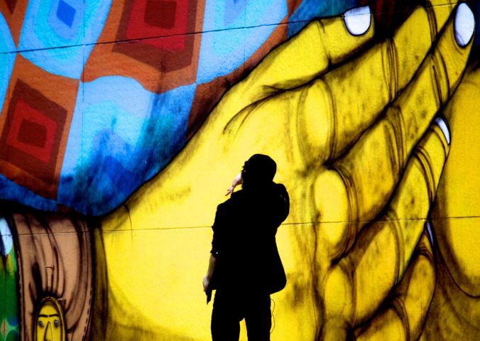 boston greenway os gemeos mural man performing 4