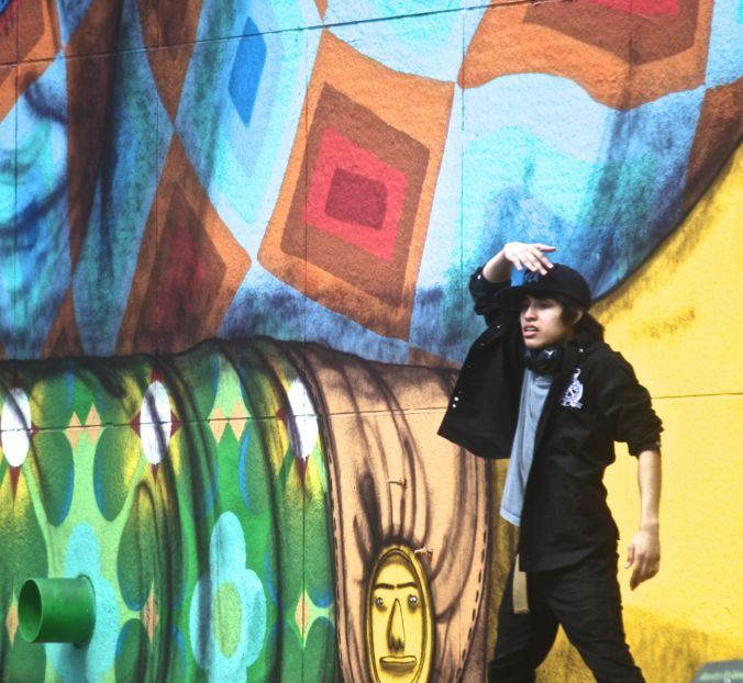 boston greenway os gemeos mural man performing 5