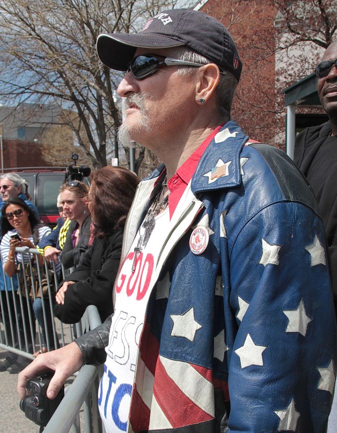 boston memorial service for victims of marathon bombing man in flag jacket t shirt god bless boston