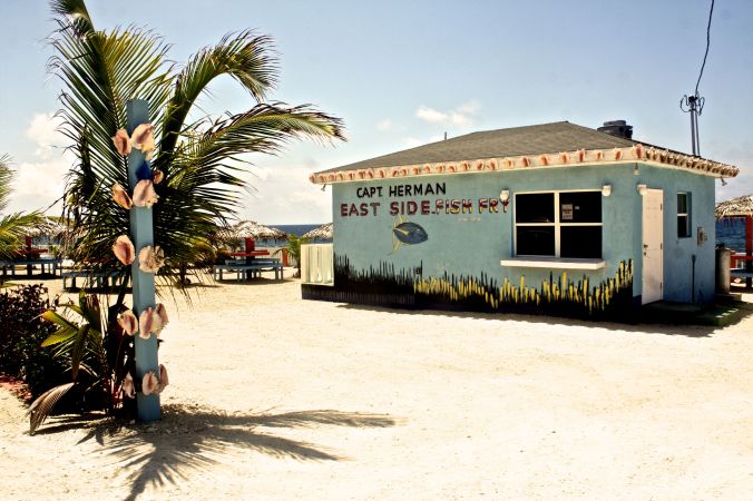 cayman islands captain herman fish fry view with conch shells