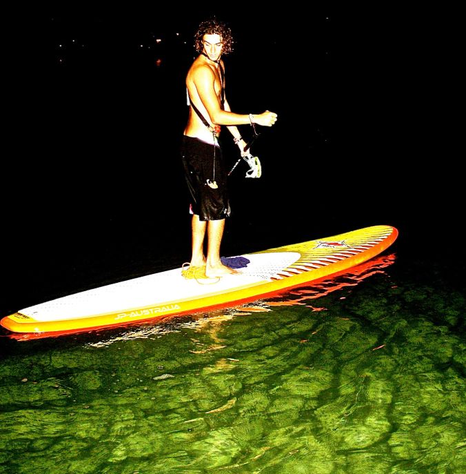 cayman islands kayaker on green water