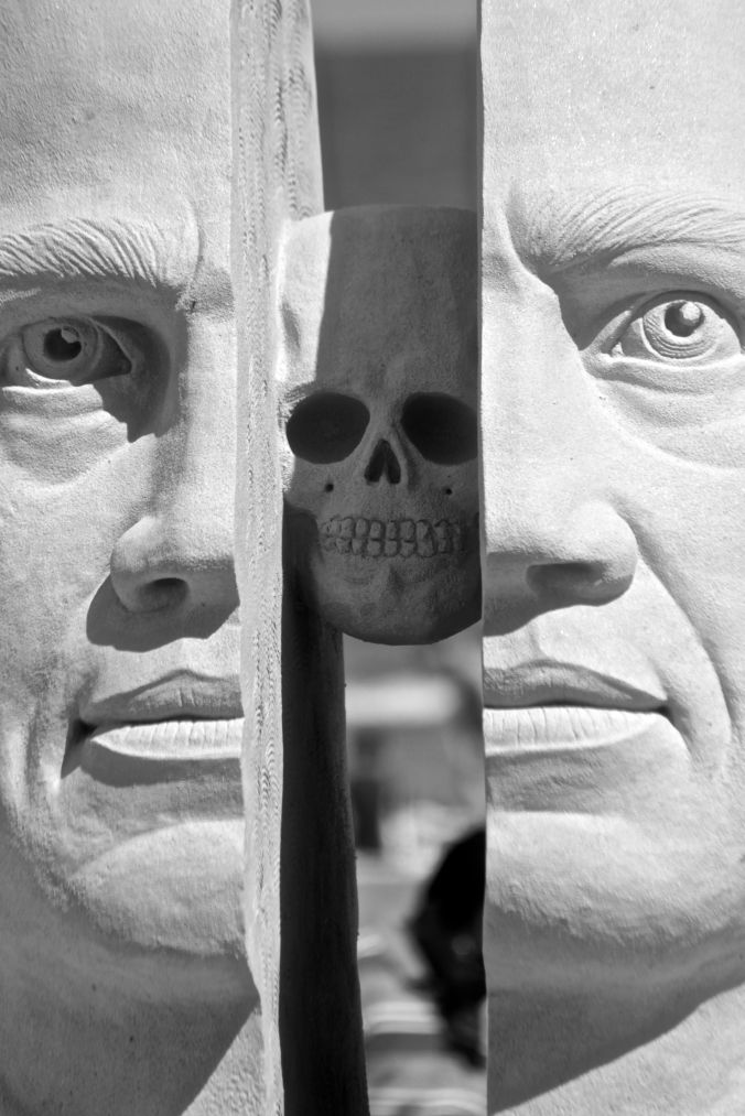 boston revere beach National Sand Sculpting Festival split face sand sculpture skull in the middle