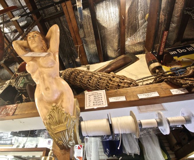 provincetown commercial street marine specialities store front of ship woman