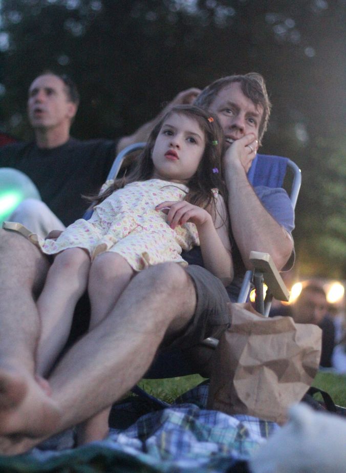 boston hatch shell night movie people father and daughter looking at the movie