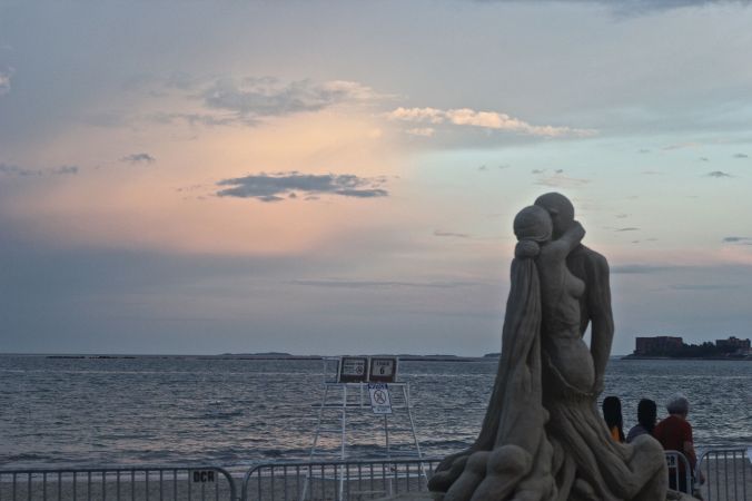 boston revere beach sand sculpture festival couple kissing statue sunset