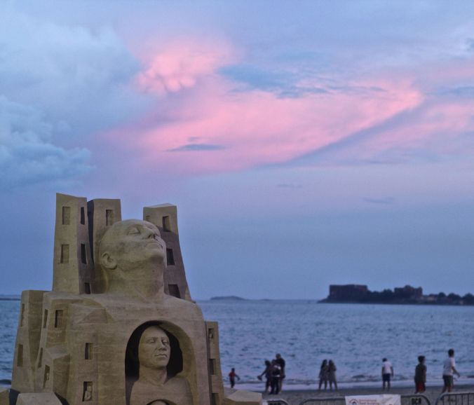 boston revere beach sand sculpture festival heads sculpture sunset
