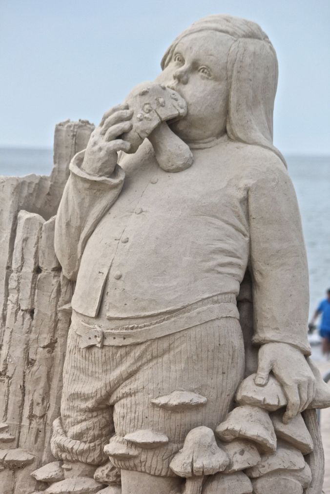 boston revere beach sand sculpture festival kid eating mushroom
