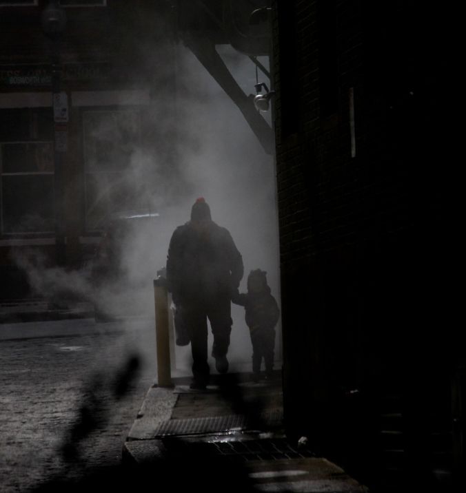 boston downtown man walking with child in steam 3
