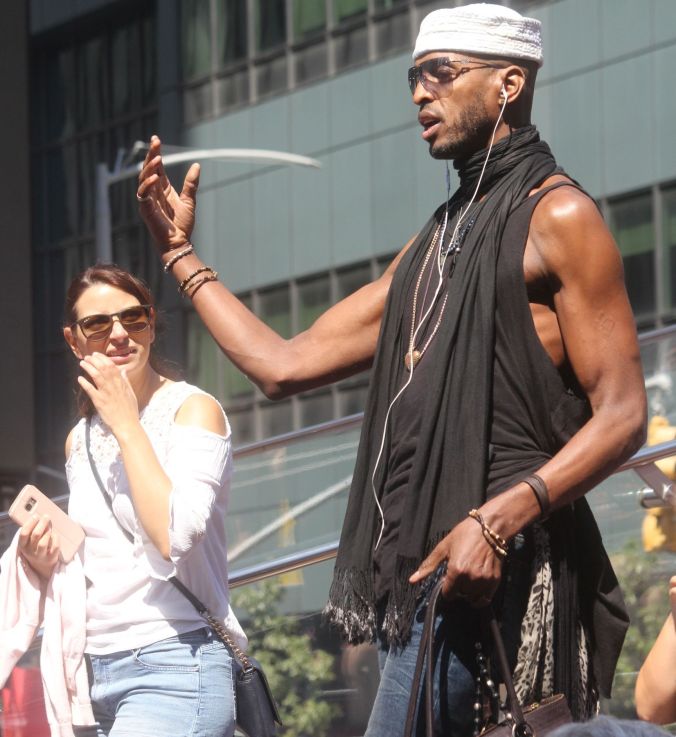 new york city times square man in hat 2
