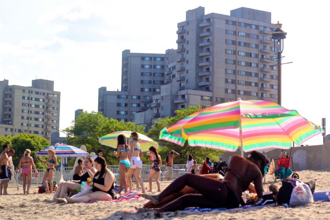 revere beach woman on beach umbrella